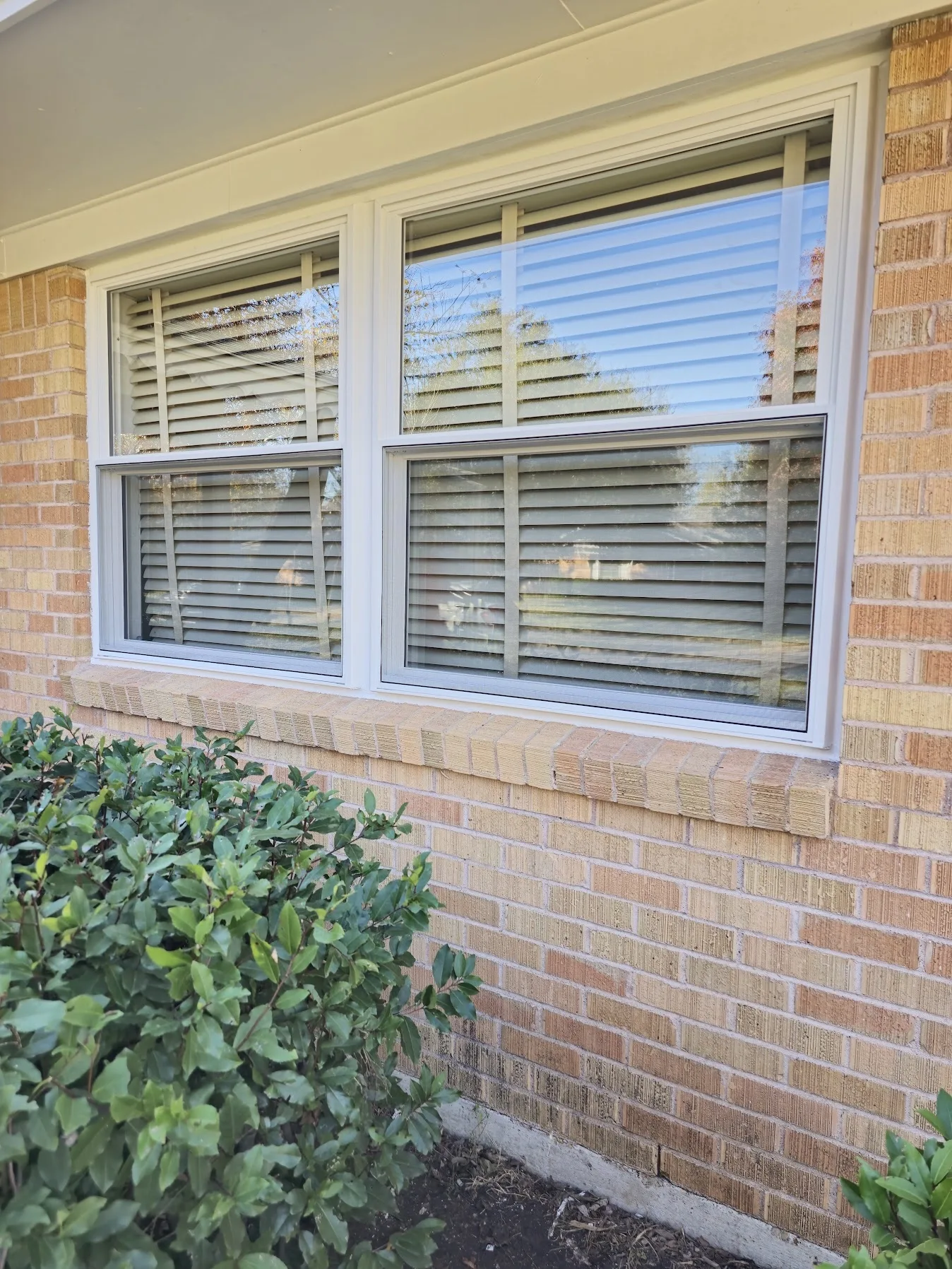 Front elevation of a Spring Valley ranch home with three new ProVia replacement windows