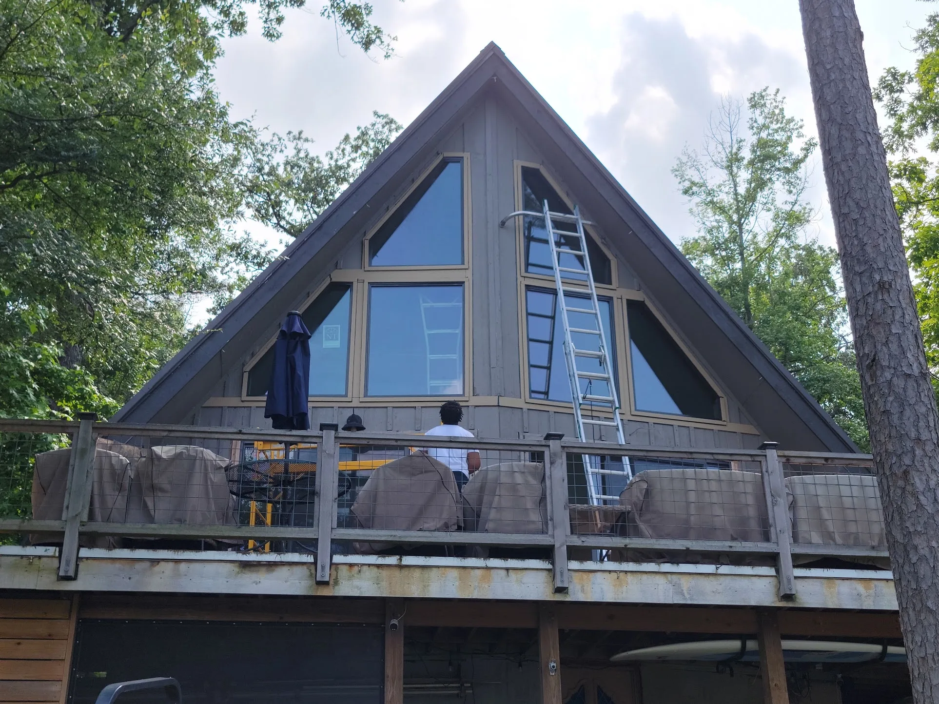 Lakefront A-frame home in The Shores with oversized replacement windows