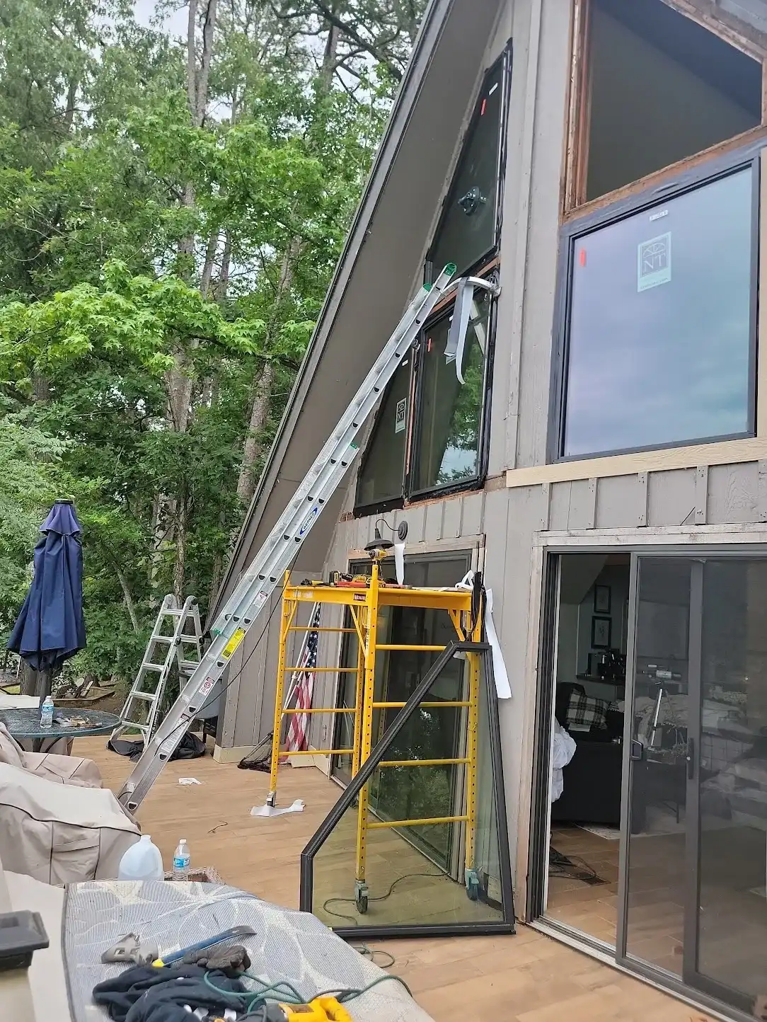 Scaffold set up for upper-story lakefront window installation in The Shores, Rockwall